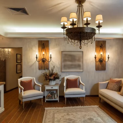 An elegant farmhouse living room with a beautiful farmhouse chandelier and rustic wall sconces. The decor is sophisticated with a mix of modern and fa